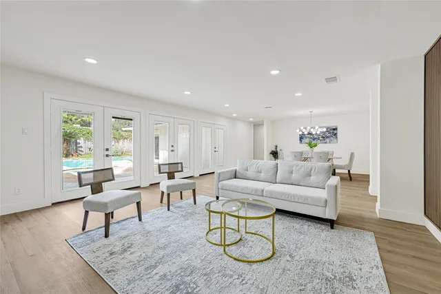 a living room with furniture rug and window