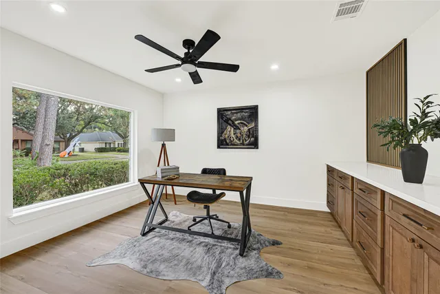 a work room with furniture and a window