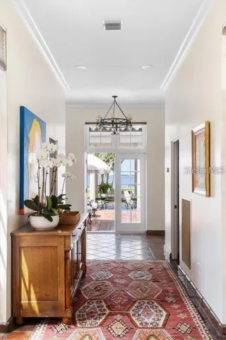 a view of an entryway with wooden floor and a door