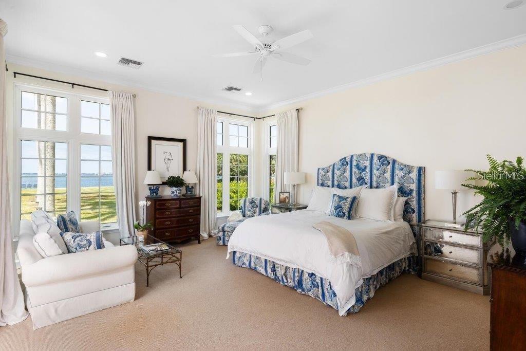 4511 Bay Shore Road Sarasota, FL 34234 - Photo 25 of 69 a bedroom with a large bed and a couch