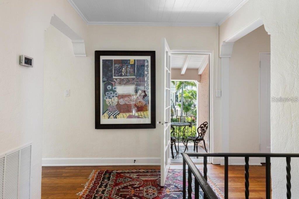 4511 Bay Shore Road Sarasota, FL 34234 - Photo 30 of 69 a view of a small space with wooden floor and a window