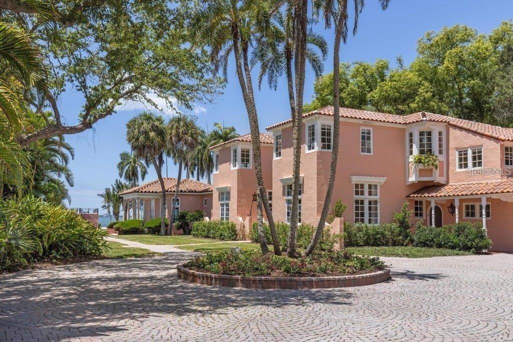 4511 Bay Shore Road Sarasota, FL 34234 - Photo 3 of 69 a front view of a residential apartment building with a yard