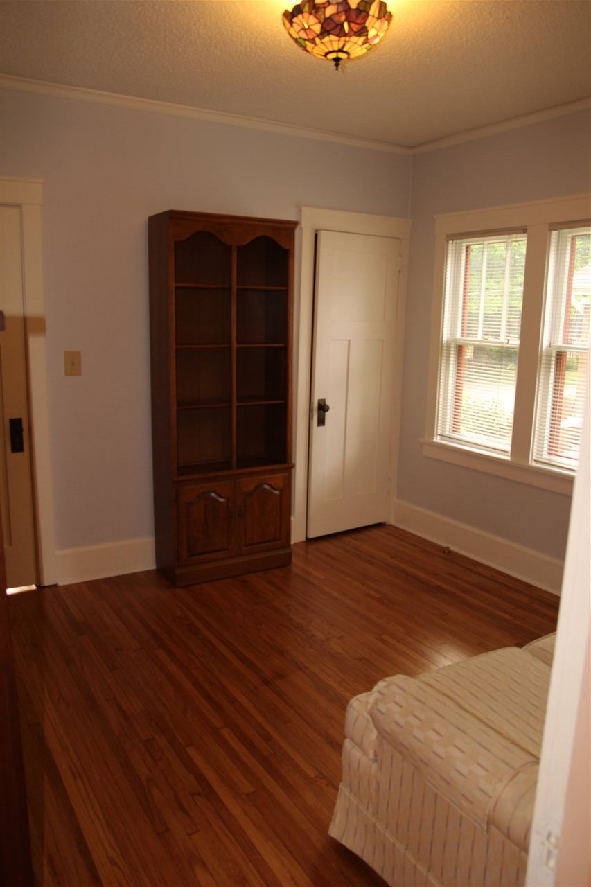 429 Dawson Avenue Rockford, IL 61107 - Photo 14 of 25 a view of an empty room with wooden floor and a window