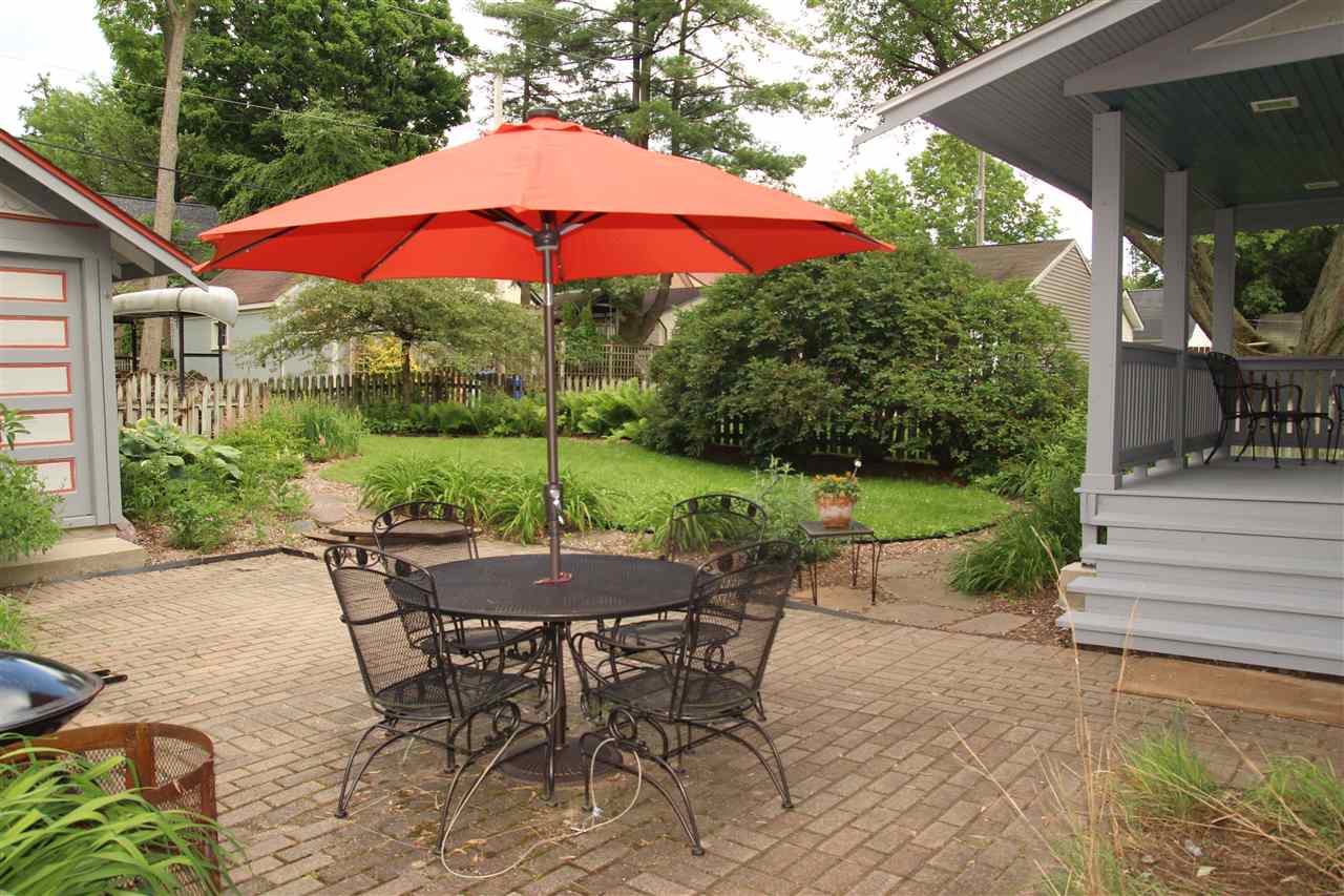 429 Dawson Avenue Rockford, IL 61107 - Photo 18 of 25 a view of a patio with a table and chairs under an umbrella
