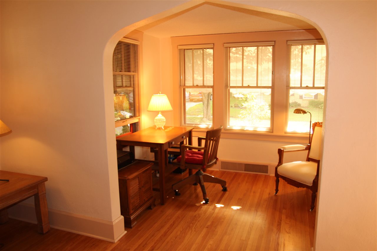 429 Dawson Avenue Rockford, IL 61107 - Photo 4 of 25 a workspace with furniture and a window