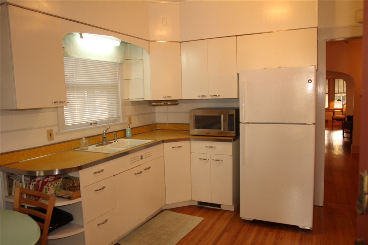 429 Dawson Avenue Rockford, IL 61107 - Photo 8 of 25 a kitchen with a sink and a refrigerator