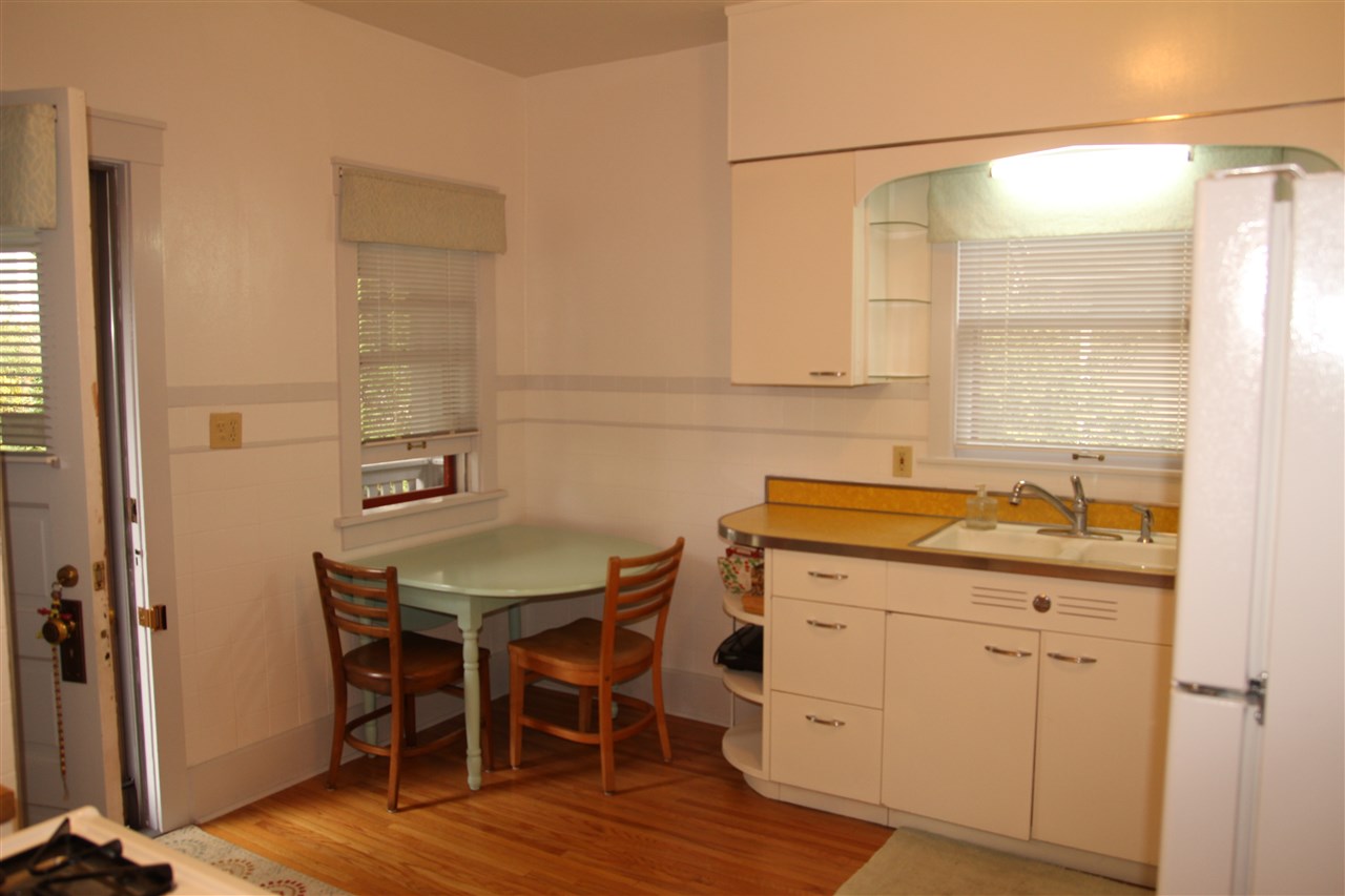 429 Dawson Avenue Rockford, IL 61107 - Photo 10 of 25 a kitchen with a sink cabinets and wooden floor