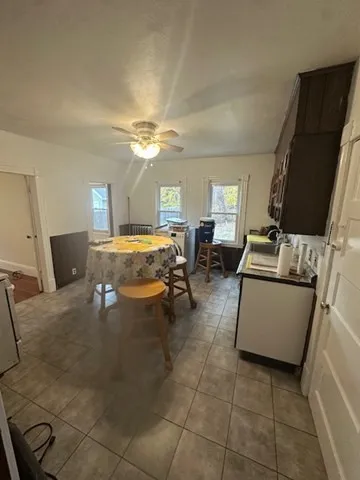 a bedroom with furniture and a chandelier
