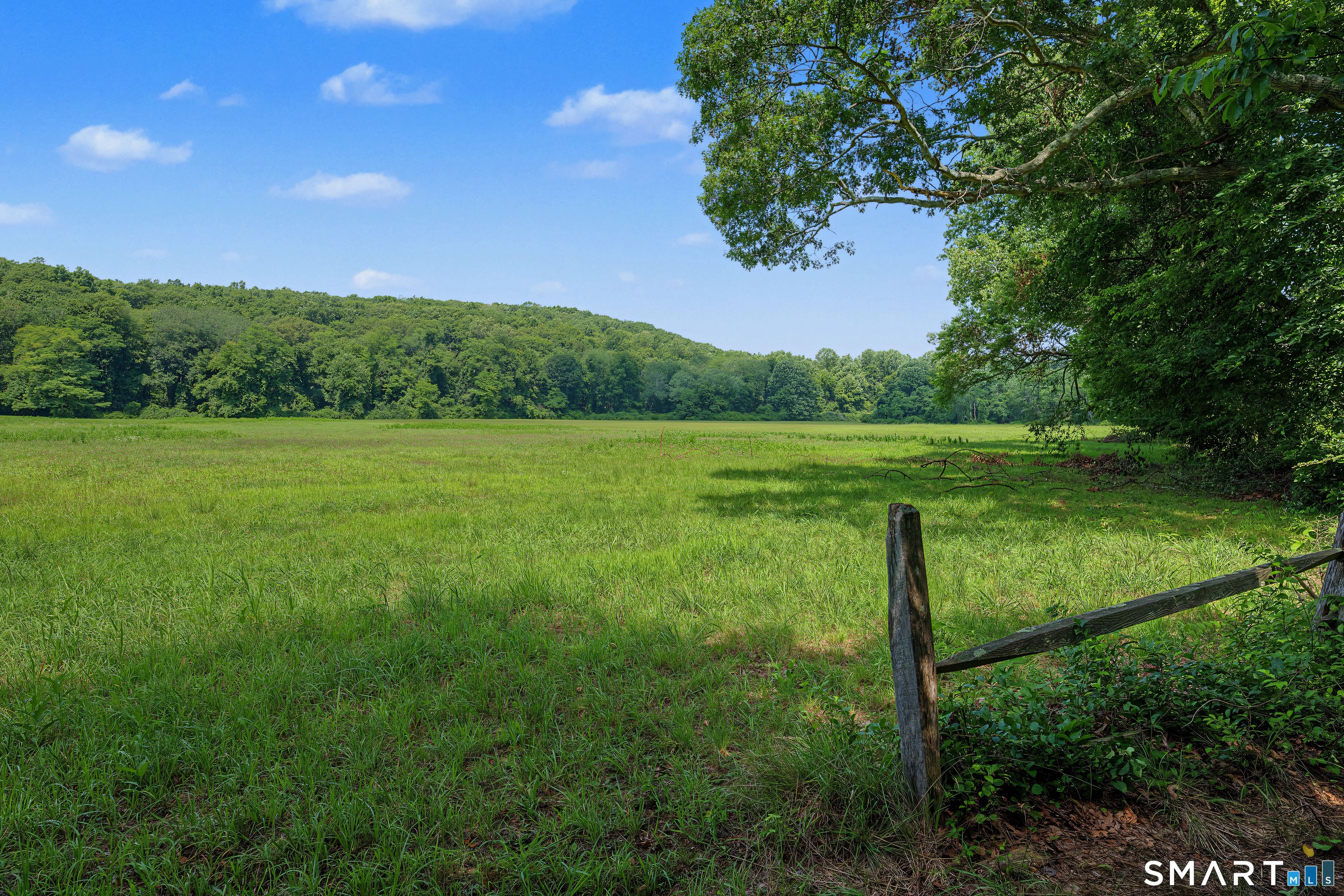 Westbrook Road Ivoryton, CT 06442 - Photo 8 of 30 Looking northwest from the gate over the 16 acres of farmer's field with another 17 acres of woods as the backdrop.