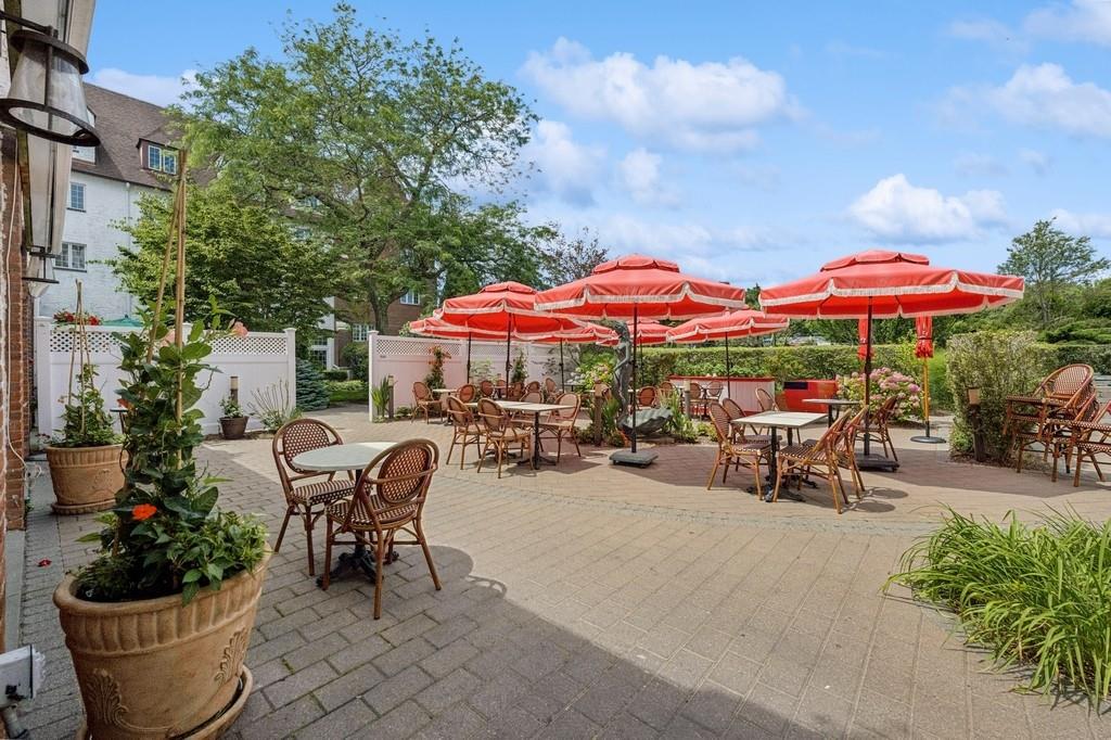 236 Edgemere Street, Unit 427 Montauk, NY 11954 - Photo 17 of 42 View of patio / terrace with outdoor dining area