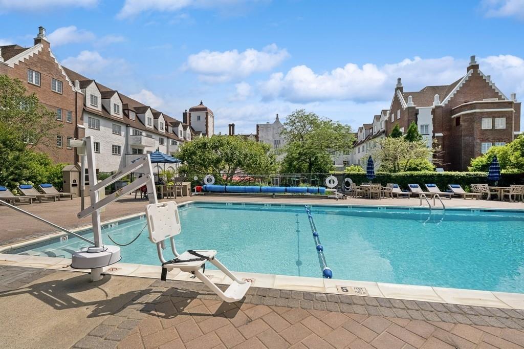 236 Edgemere Street, Unit 427 Montauk, NY 11954 - Photo 20 of 42 Community pool with a residential view