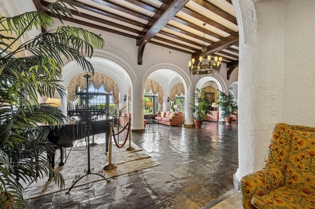 236 Edgemere Street, Unit 427 Montauk, NY 11954 - Photo 25 of 42 Building lobby with beamed ceiling and a textured wall