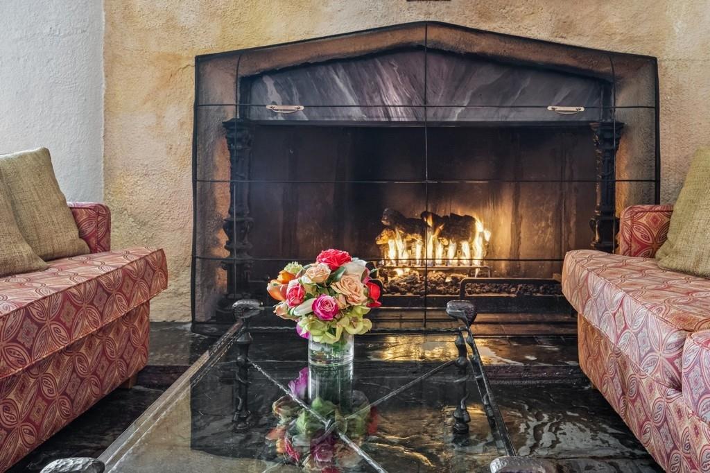 236 Edgemere Street, Unit 427 Montauk, NY 11954 - Photo 26 of 42 Detailed view of sitting with fireplace