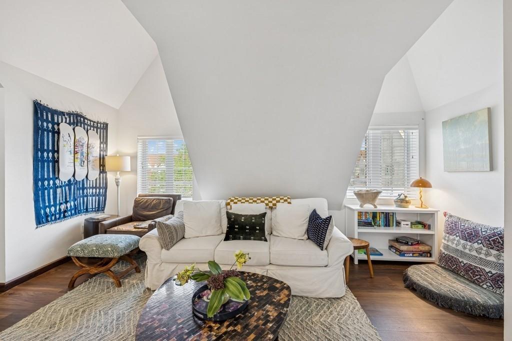 236 Edgemere Street, Unit 427 Montauk, NY 11954 - Photo 7 of 42 Living area with wood finished floors and high vaulted ceiling
