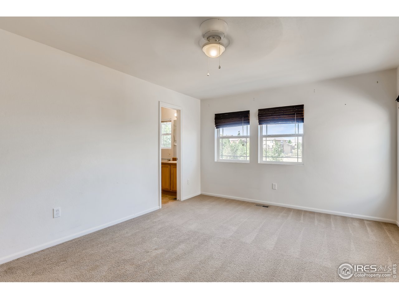 2175 Coach House Loop Castle Rock, CO 80109 - Photo 12 of 33 an empty room with windows