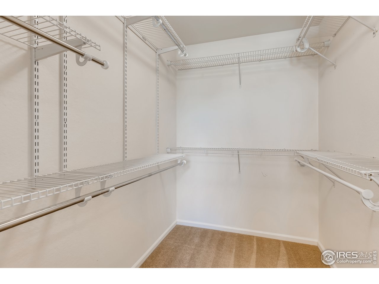 2175 Coach House Loop Castle Rock, CO 80109 - Photo 19 of 33 a view of a kitchen with white cabinets and a window