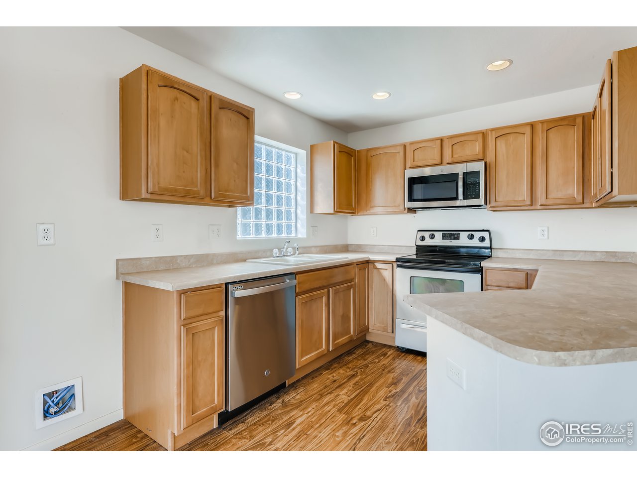 2175 Coach House Loop Castle Rock, CO 80109 - Photo 24 of 33 a kitchen with kitchen island granite countertop a sink cabinets and stainless steel appliances