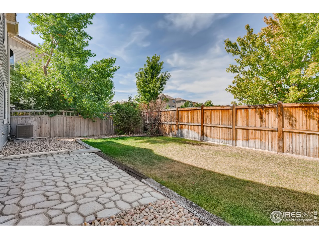 2175 Coach House Loop Castle Rock, CO 80109 - Photo 31 of 33 a view of back yard with outdoor seating and green space
