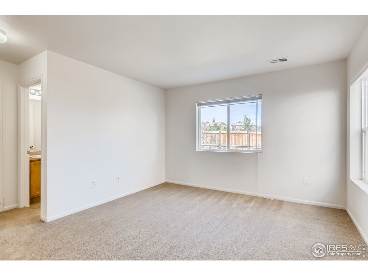 2175 Coach House Loop Castle Rock, CO 80109 - Photo 4 of 33 a view of an empty room with a window