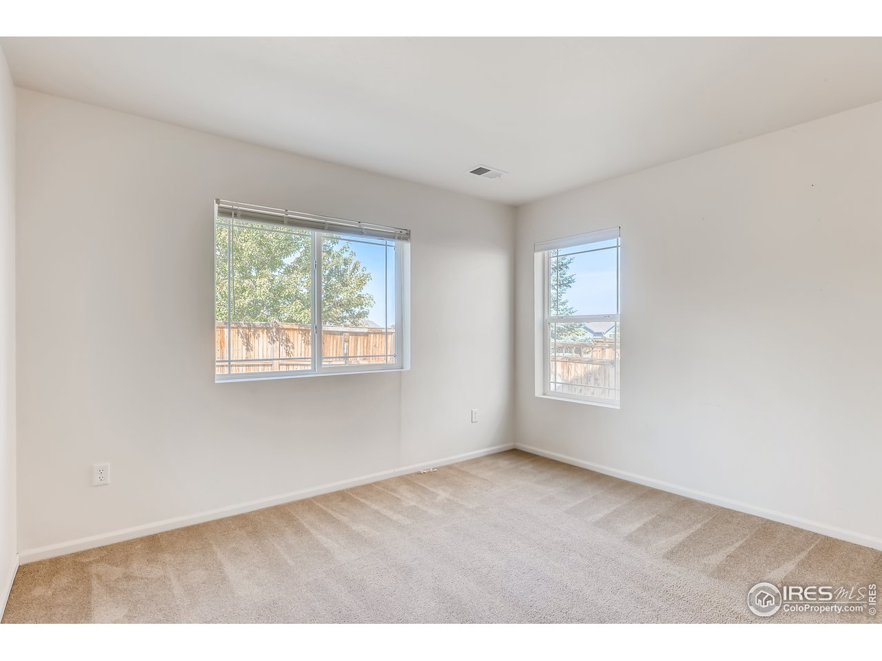 2175 Coach House Loop Castle Rock, CO 80109 - Photo 7 of 33 a view of an empty room with a window