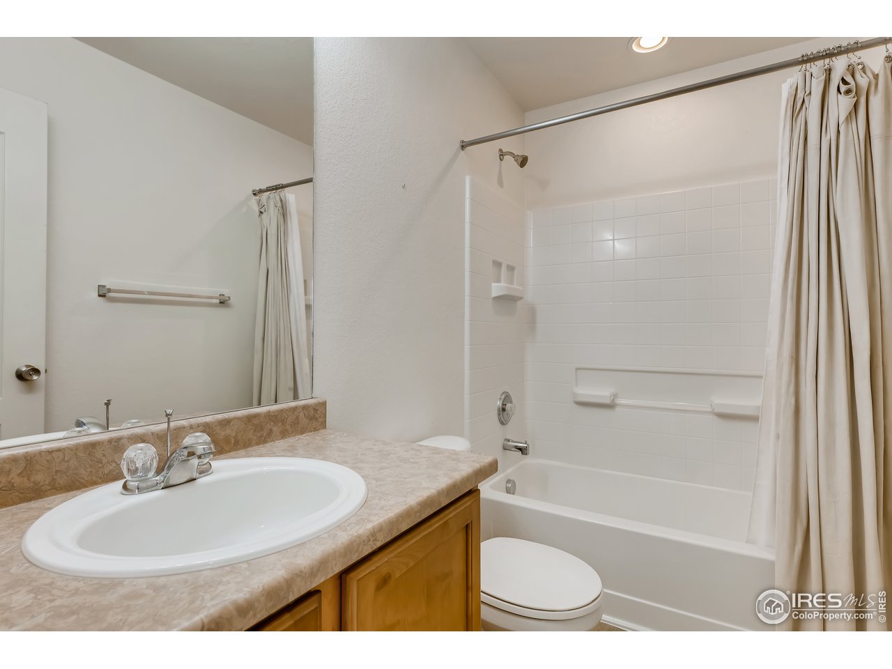 2175 Coach House Loop Castle Rock, CO 80109 - Photo 10 of 33 a bathroom with a granite countertop sink toilet and shower