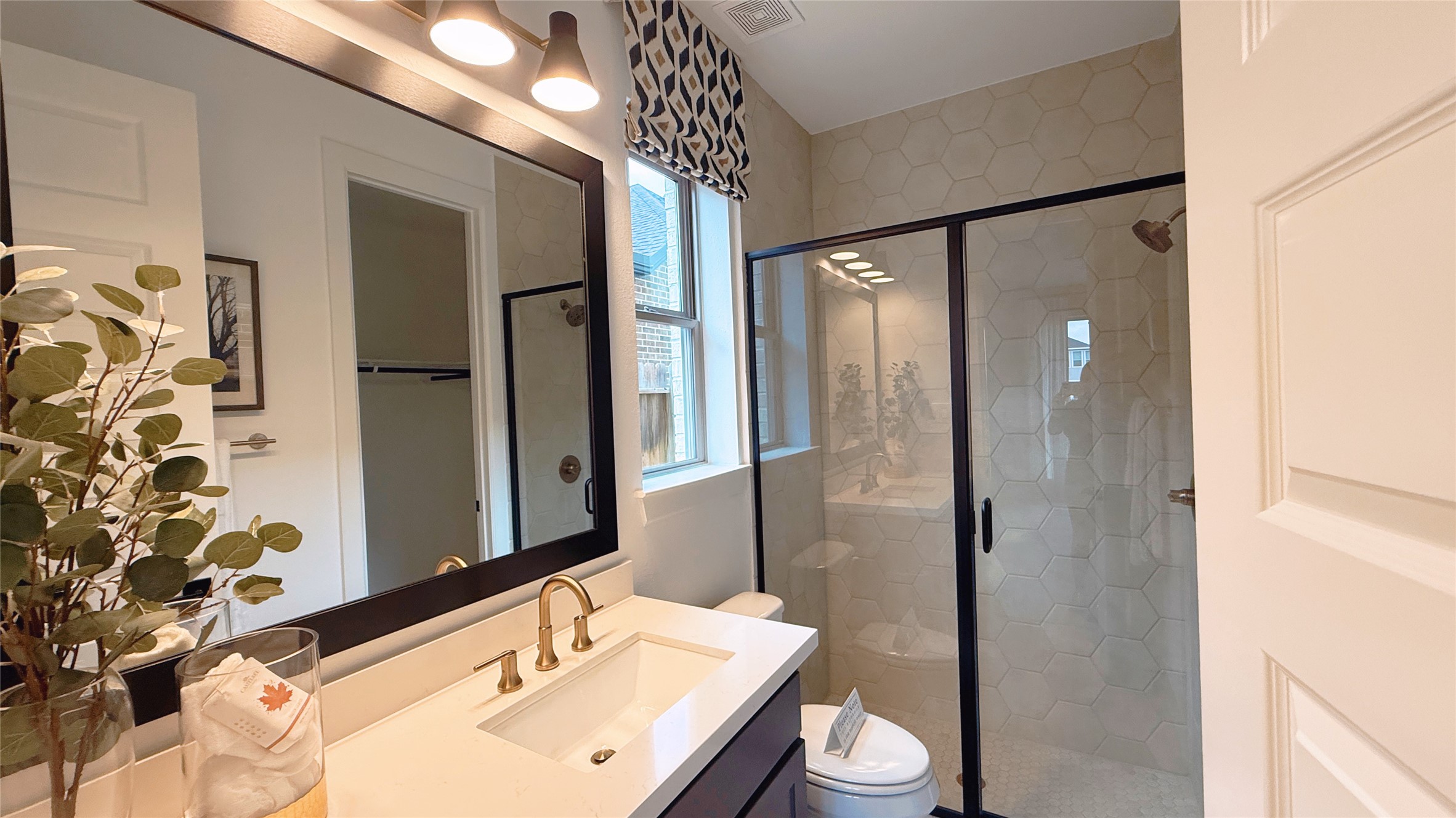 5603 Logan Ridge Lane Fulshear, TX 77441 - Photo 27 of 43 a bathroom with a sink and a mirror