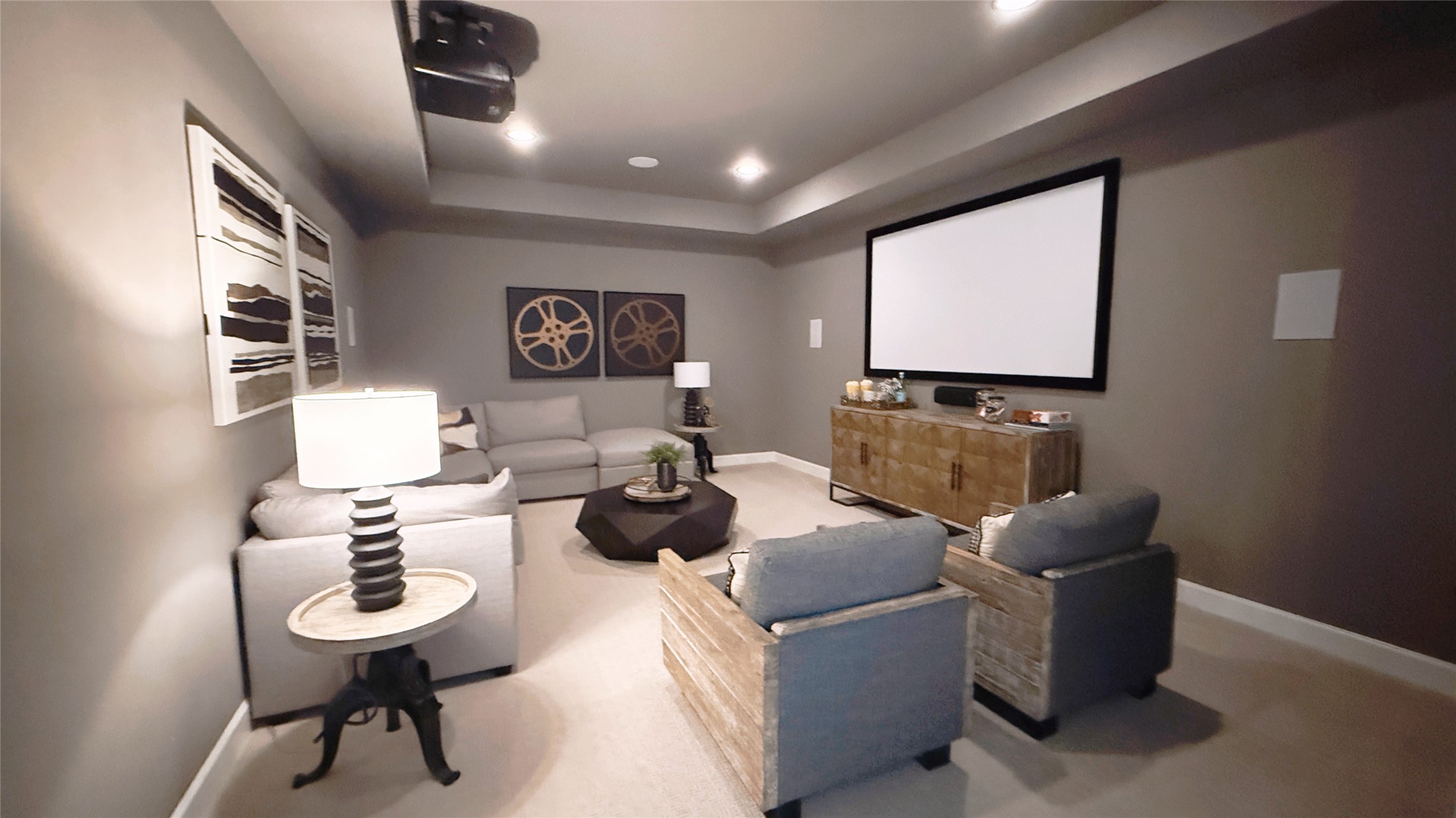 5603 Logan Ridge Lane Fulshear, TX 77441 - Photo 29 of 43 a living room with furniture a rug and a projector