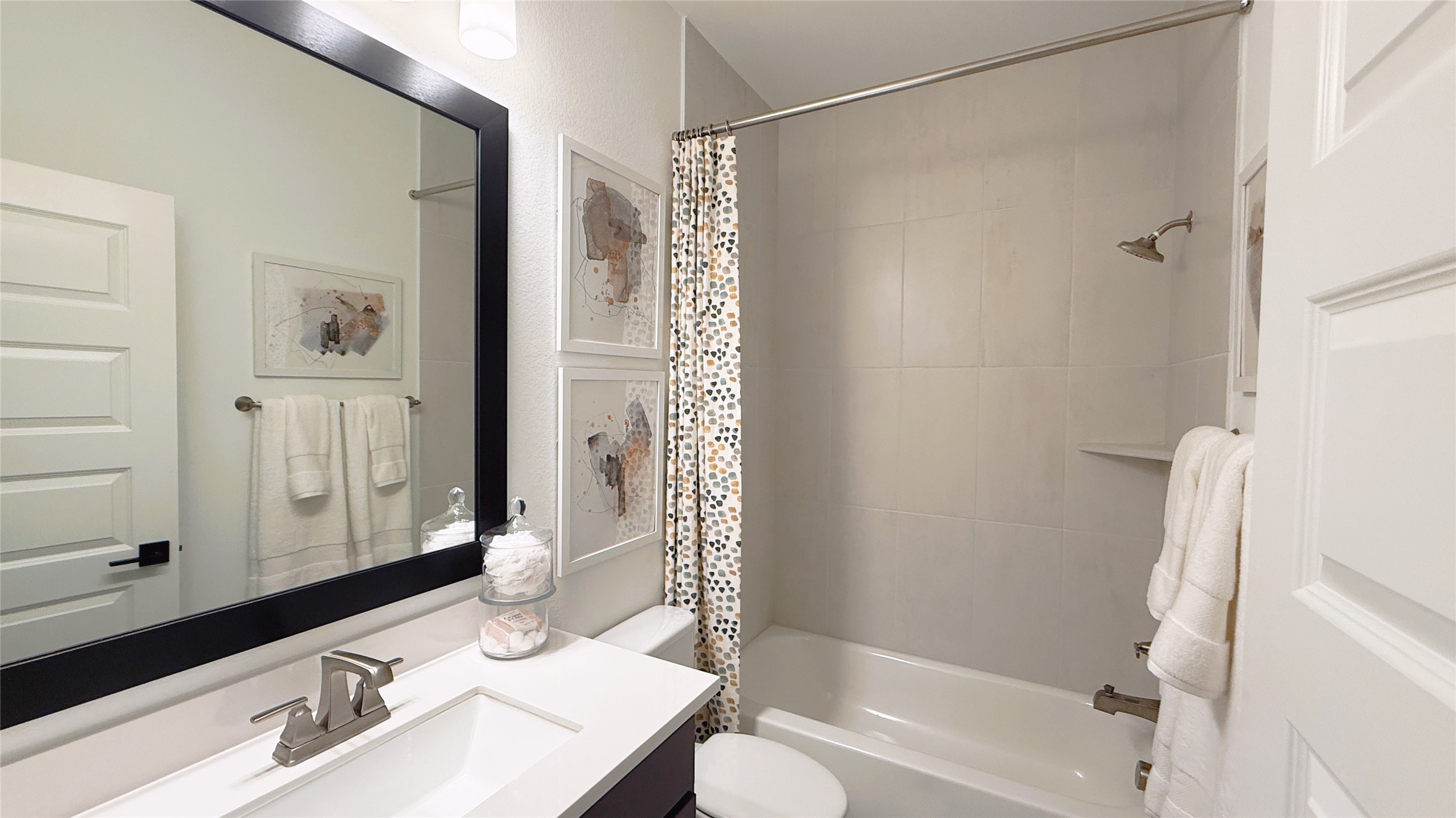 5603 Logan Ridge Lane Fulshear, TX 77441 - Photo 37 of 43 a bathroom with a sink a toilet a mirror and shower