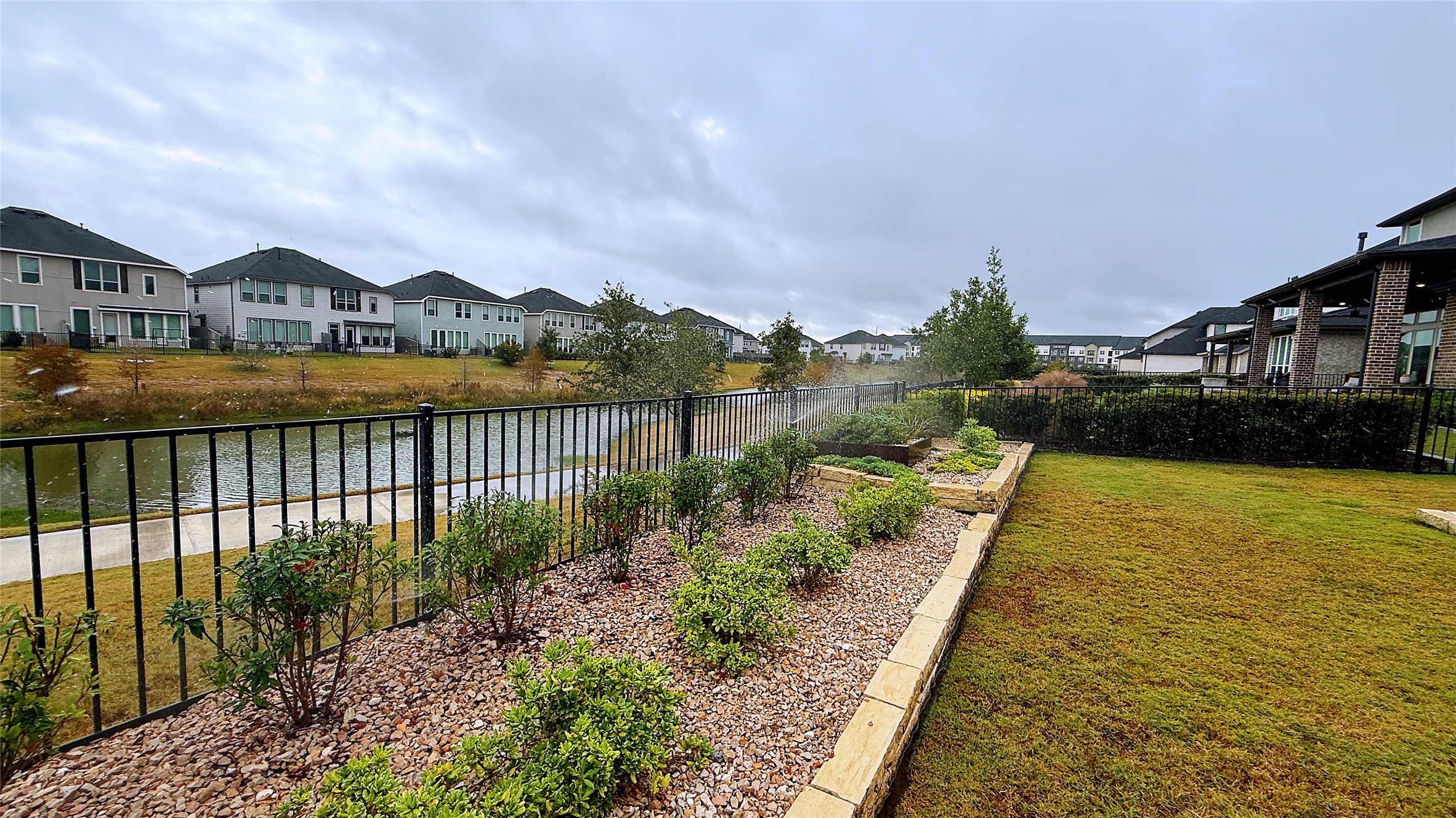 5603 Logan Ridge Lane Fulshear, TX 77441 - Photo 40 of 43 a view of swimming pool and lake view
