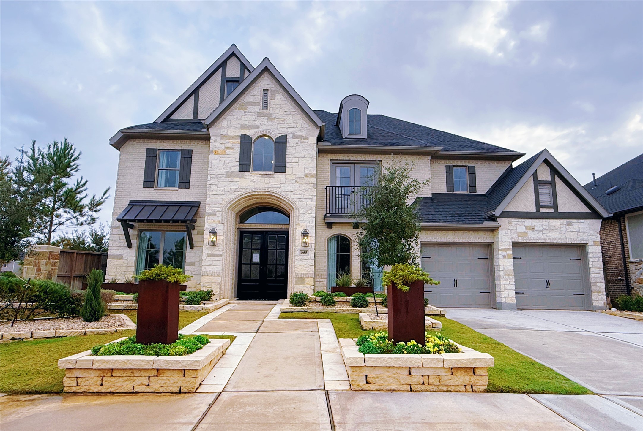 5603 Logan Ridge Lane Fulshear, TX 77441 - Photo 5 of 43 a front view of a house with garden