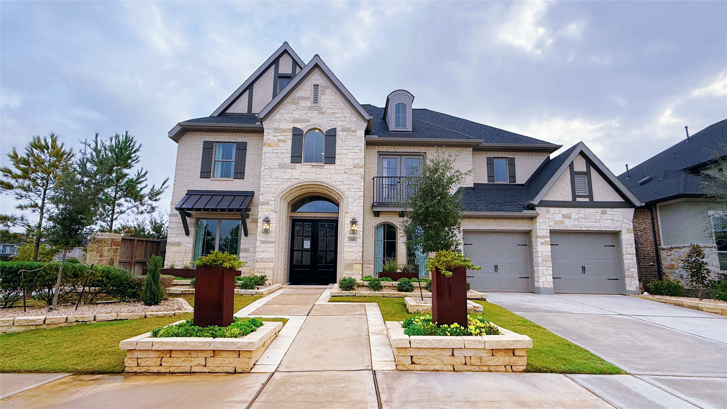 5603 Logan Ridge Lane Fulshear, TX 77441 - Photo 6 of 43 a front view of a house with a garden