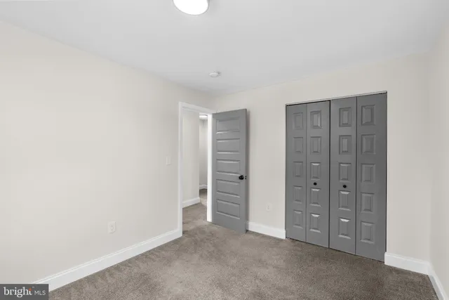 an entryway in a hall with a window