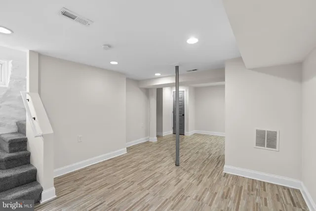 a white toilet sitting next to a bathroom sink