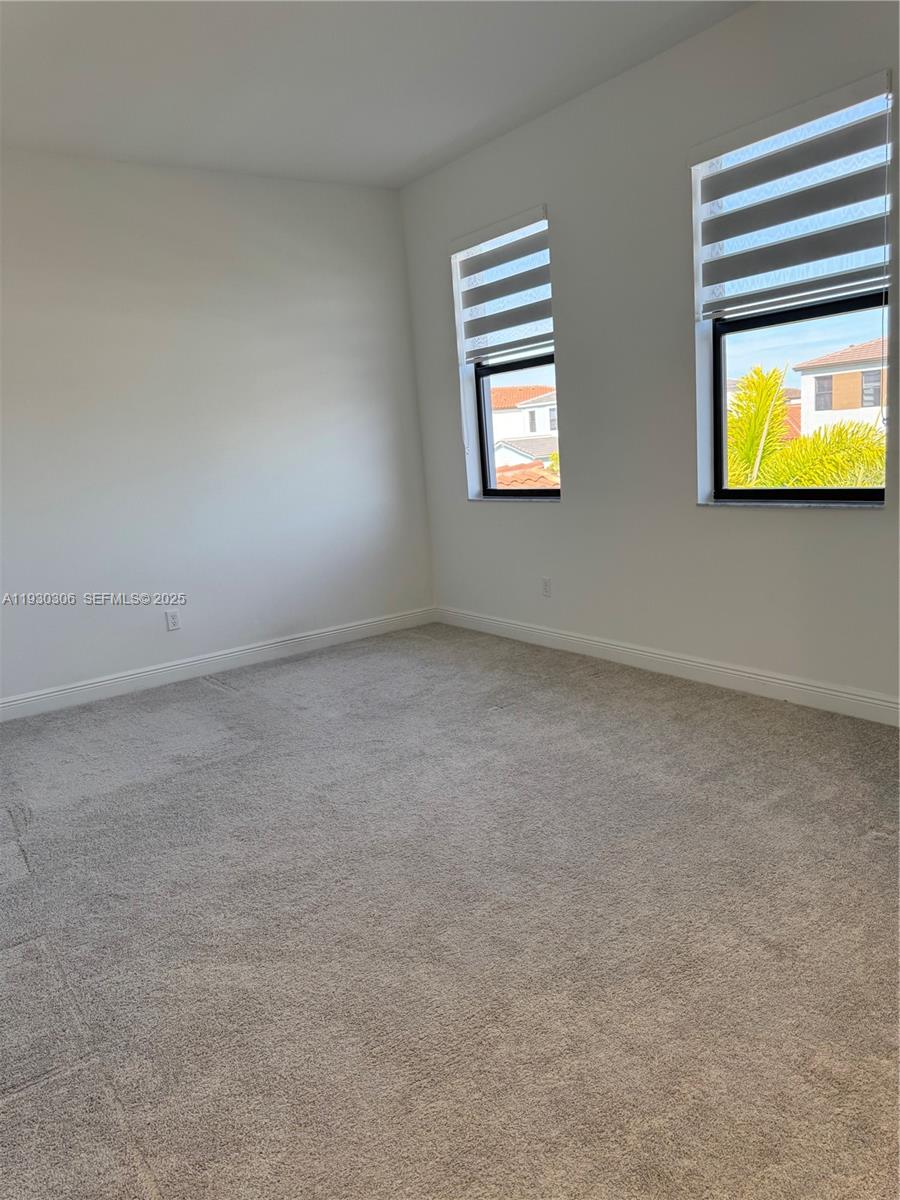 16456 Sea Turtle Place, Unit 16456 Westlake, FL 33470 - Photo 19 of 27 an empty room with a window