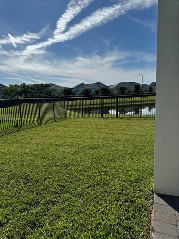 a view of a lake with a yard