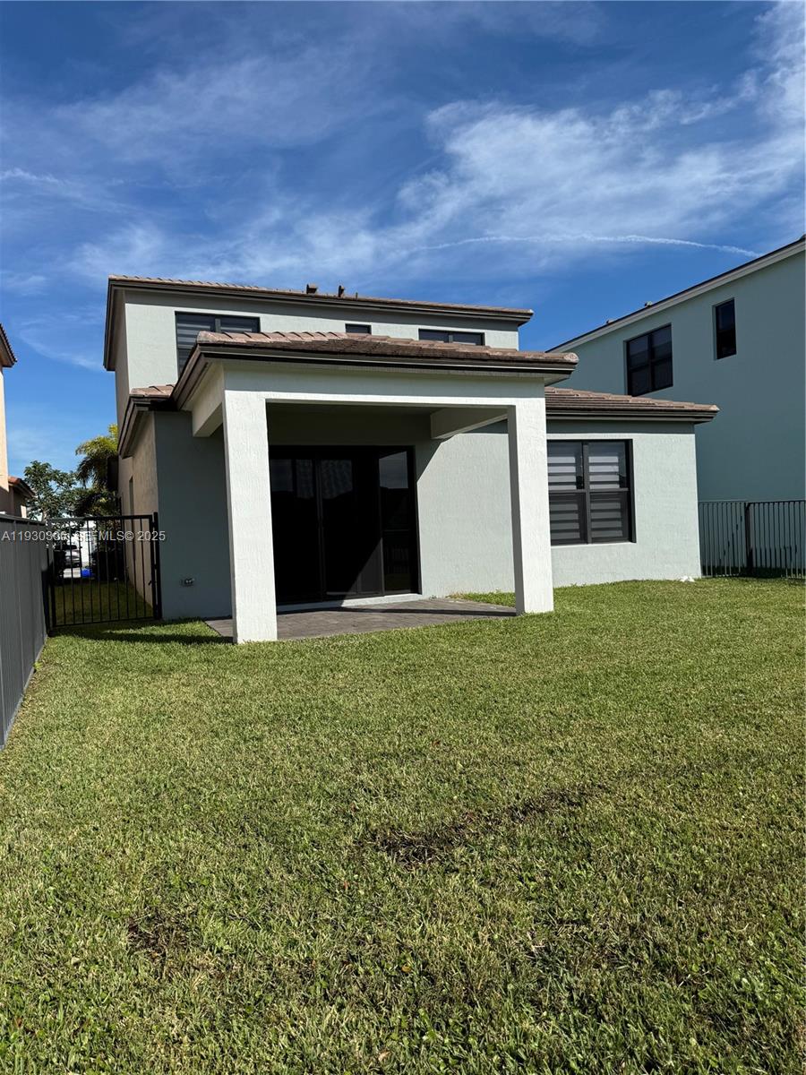 16456 Sea Turtle Place, Unit 16456 Westlake, FL 33470 - Photo 25 of 27 front view of a house with a yard