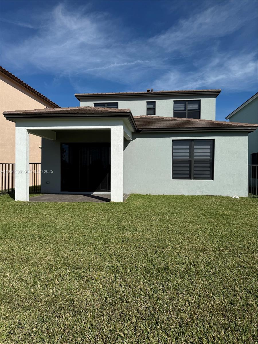 16456 Sea Turtle Place, Unit 16456 Westlake, FL 33470 - Photo 26 of 27 a front view of house with yard