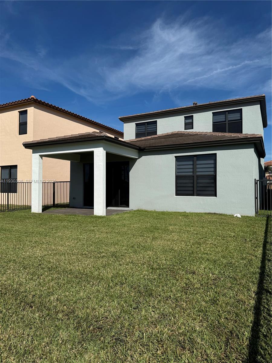 16456 Sea Turtle Place, Unit 16456 Westlake, FL 33470 - Photo 27 of 27 a backyard of a house with lots of green space