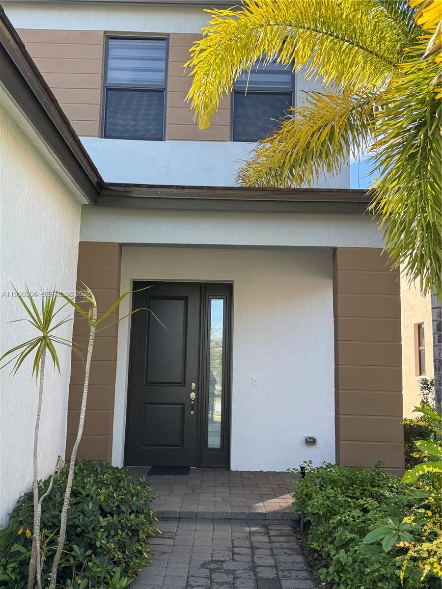 16456 Sea Turtle Place, Unit 16456 Westlake, FL 33470 - Photo 4 of 27 a view of entryway with a house