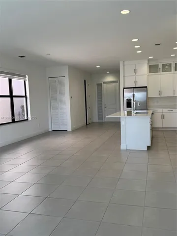 a view of a kitchen with a sink and an oven