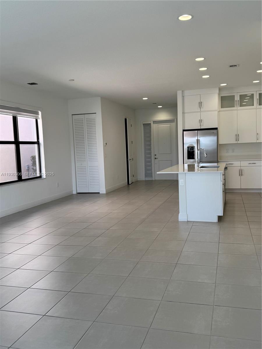 16456 Sea Turtle Place, Unit 16456 Westlake, FL 33470 - Photo 8 of 27 a view of a kitchen with a sink and an oven