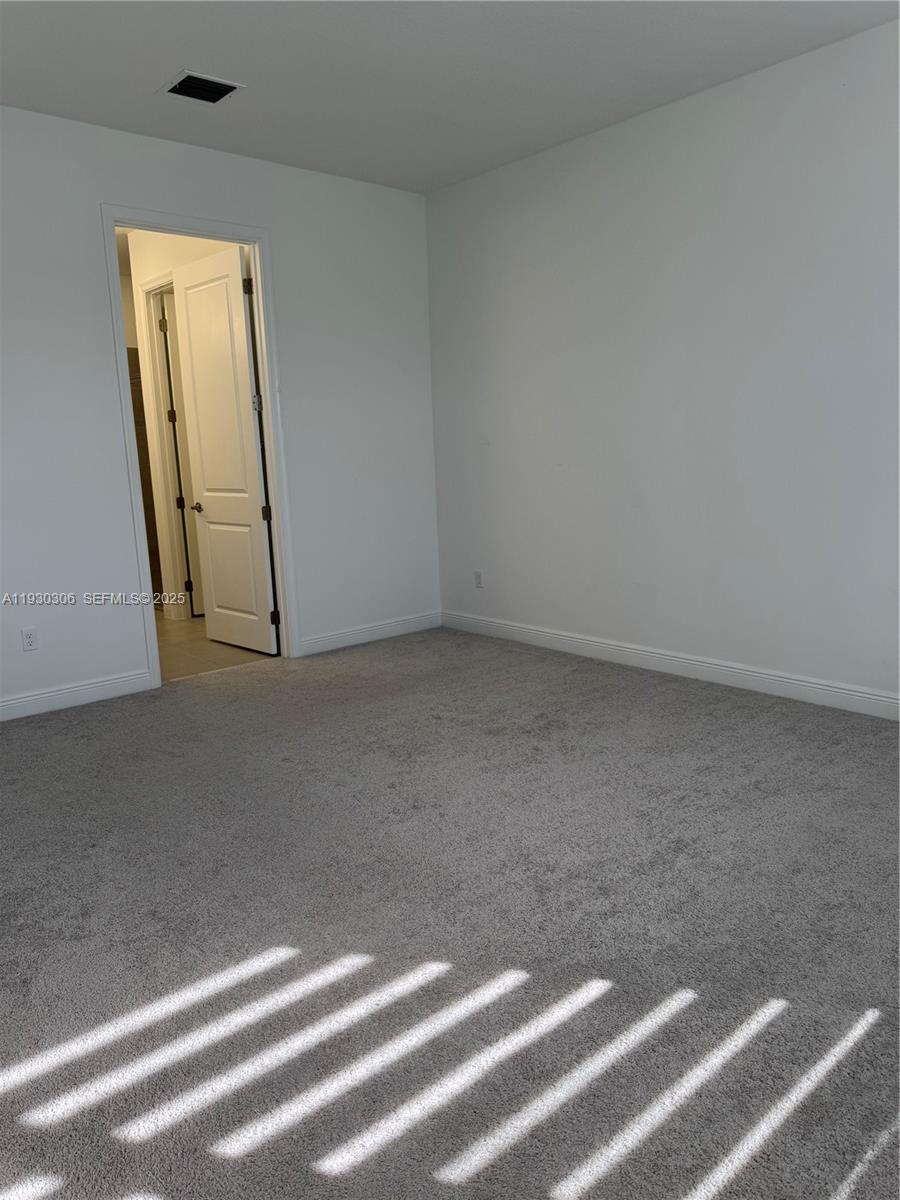 16456 Sea Turtle Place, Unit 16456 Westlake, FL 33470 - Photo 9 of 27 a view of a room with wooden floor