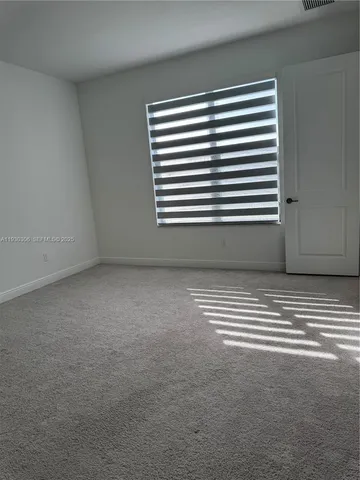 a view of a room that has a window in it