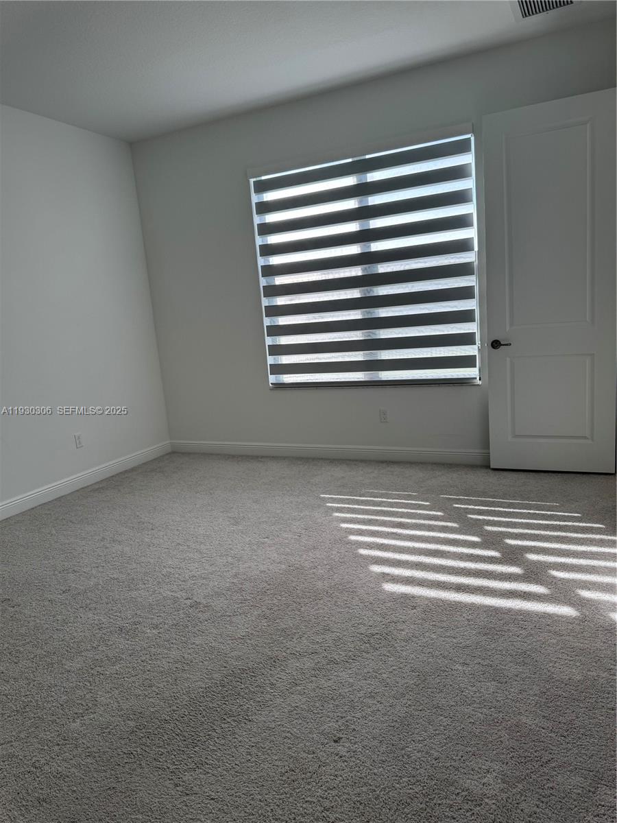 16456 Sea Turtle Place, Unit 16456 Westlake, FL 33470 - Photo 10 of 27 a view of a room that has a window in it