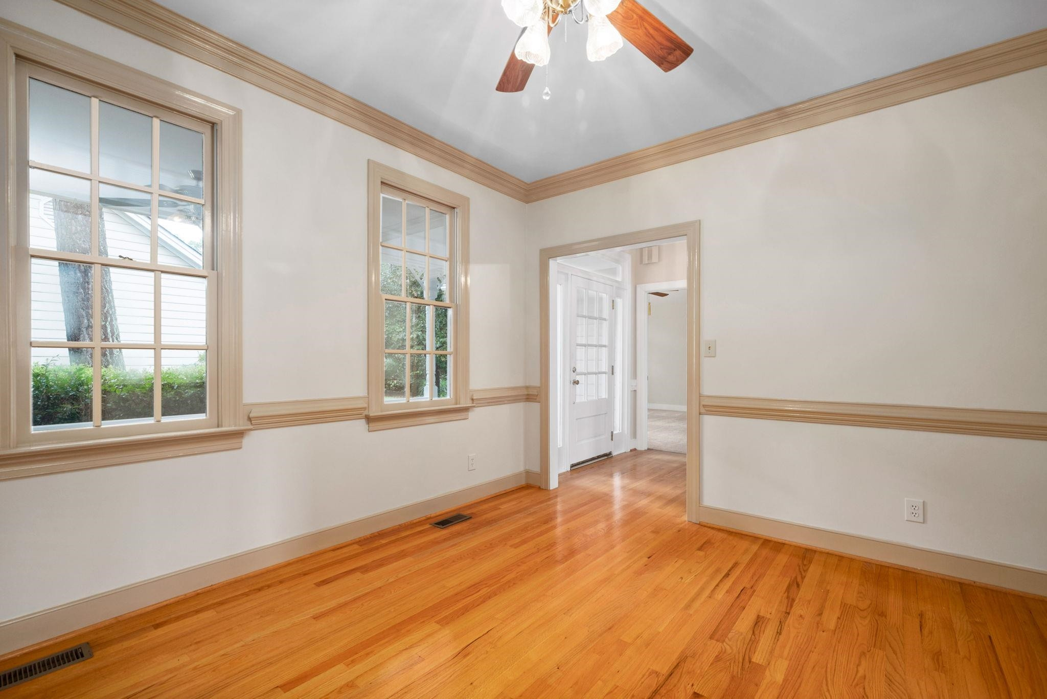 2965 Tillinghast Trail Raleigh, NC 27613 - Photo 10 of 48 a view of an empty room with wooden floor and a window
