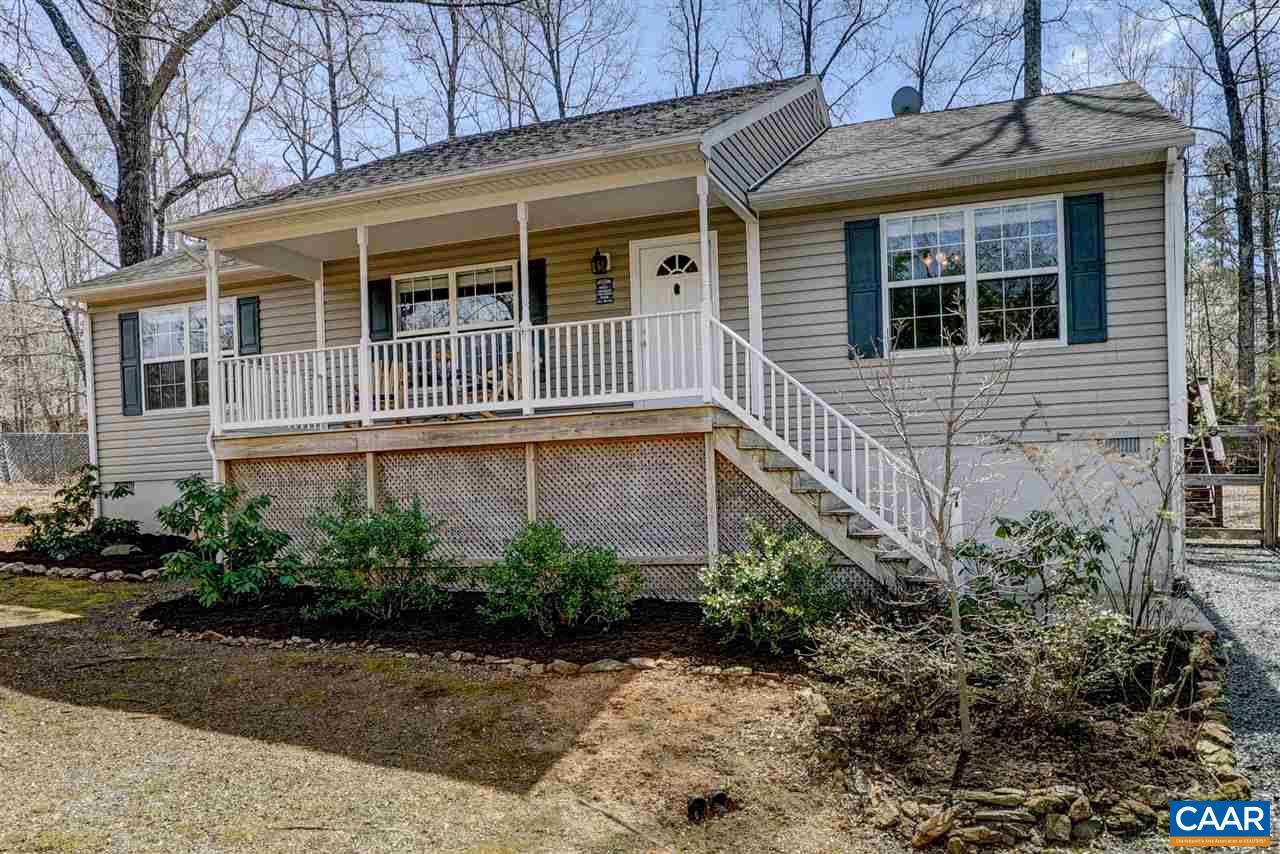7 Haversack Road Palmyra, VA 22963 - Photo 1 of 32 a view of a house with potted plants and a bench
