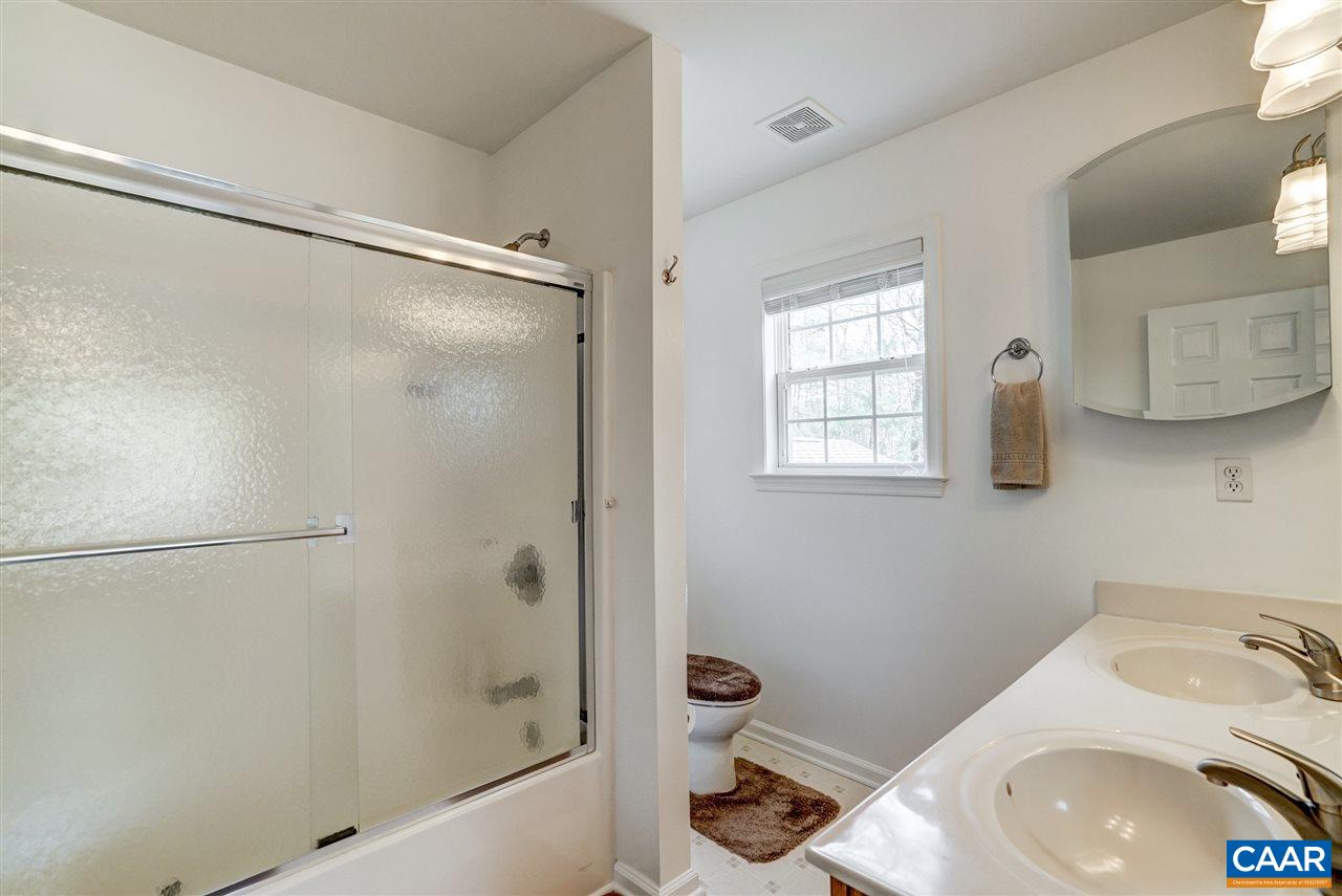 7 Haversack Road Palmyra, VA 22963 - Photo 28 of 32 a bathroom with a sink a toilet and shower