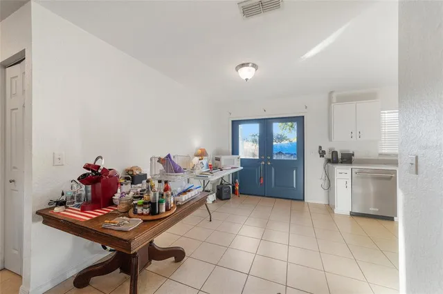 a kitchen with a refrigerator a stove top oven and a sink