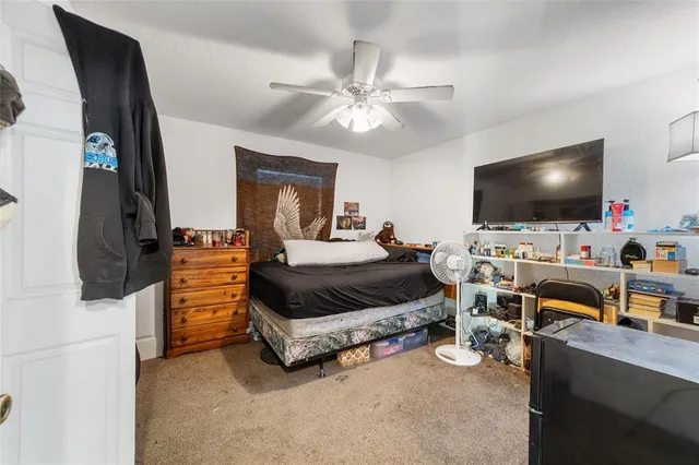 a bedroom with a bed and a closet