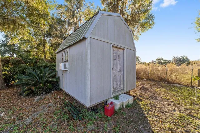 a view of a yard and front view of a house